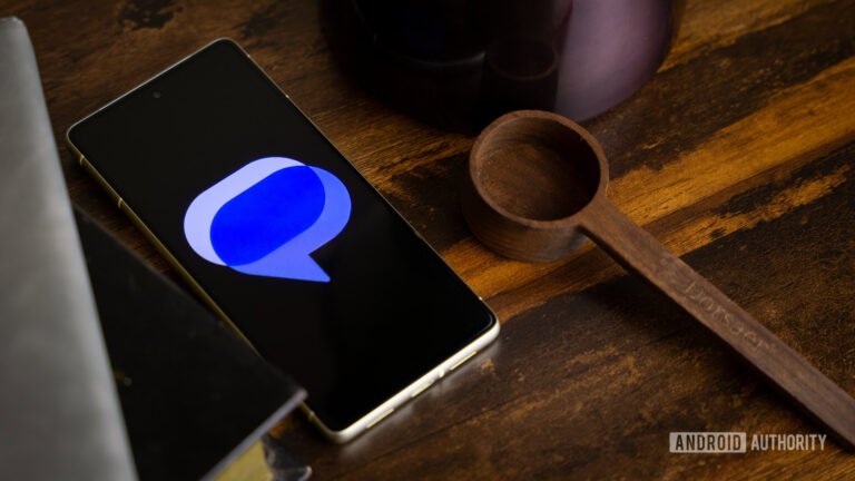 Google-Messages-logo-on-smartphone-laying-on-table-1.jpg