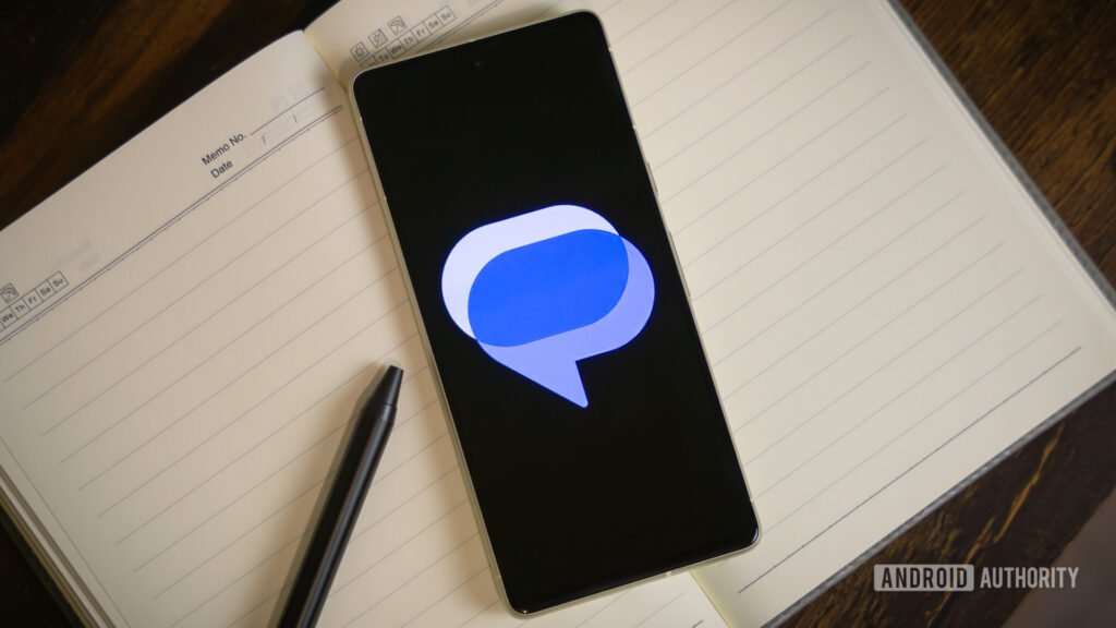 Google-Messages-logo-on-smartphone-laying-on-table-4.jpg
