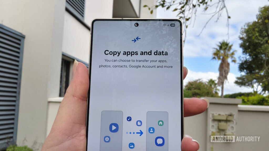 a-smartphone-held-in-a-hand-with-a-prompt-to-copy-apps-and-data-scaled.jpg