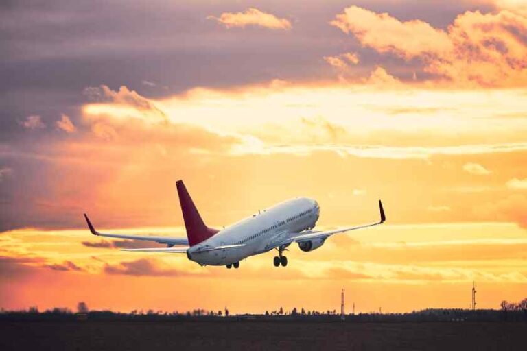 airplane-flying-runway-against-sky-sunset-1.jpg
