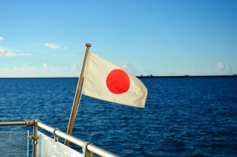 close-up-flag-against-blue-sea-1.jpg