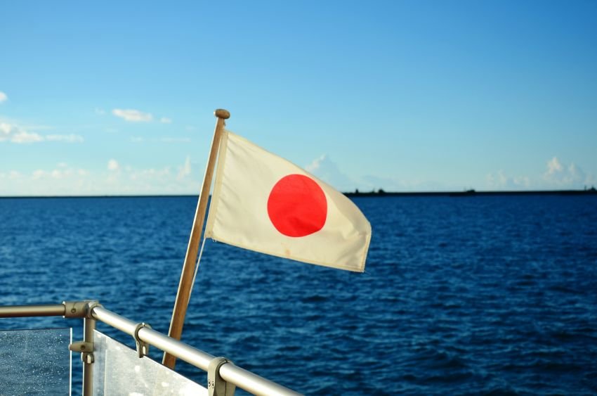 close-up-flag-against-blue-sea-1.jpg