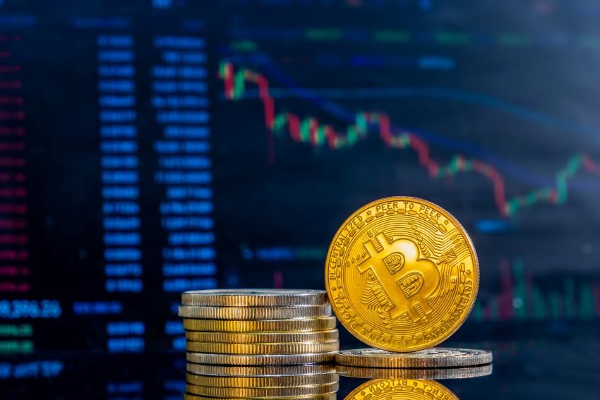 closeup-golden-bitcoins-dark-reflective-surface-histogram-decreasing-crypto-1.jpg