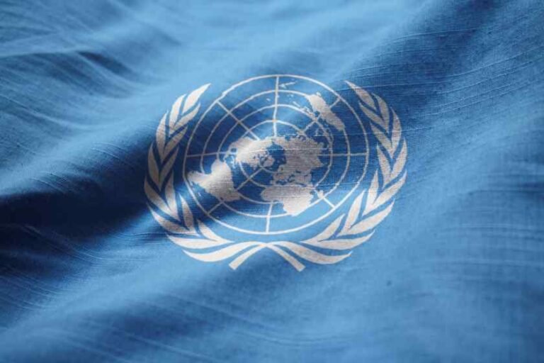 closeup-ruffled-united-nations-flag-united-nations-flag-blowing-wind-1.jpg