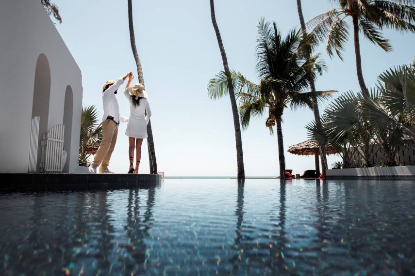 couple-dancing-by-pool-vacation-1.jpg