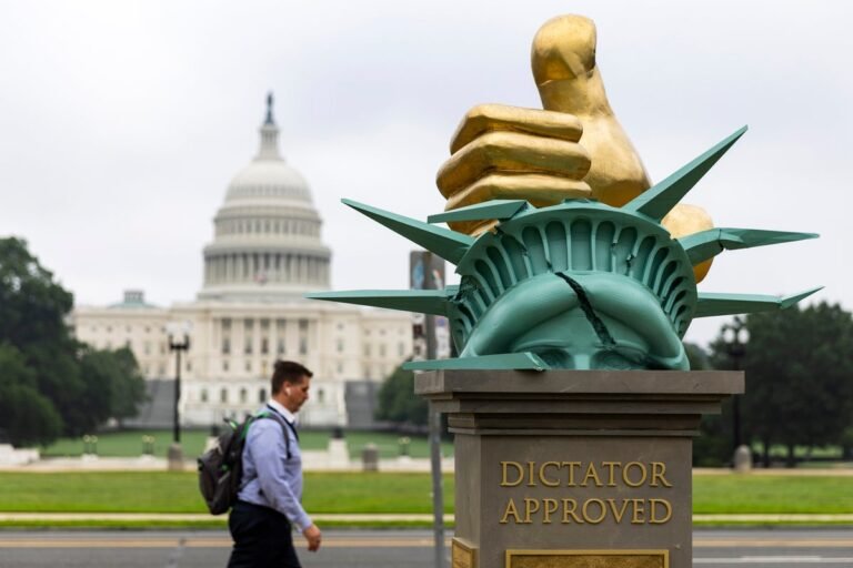 epa12183263-A-work-of-political-art-titled-Dictator-Approved-on-the-National-Mall-in-Washington-DC-U.jpeg