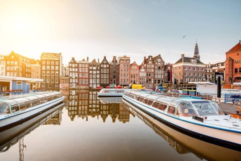 morning-view-beautiful-buildings-boats-damrak-avenue-amsterdam-1.jpg