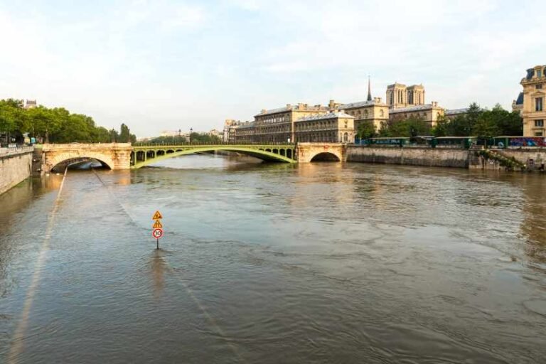notre-dame-de-paris-by-bridge-river-against-sky-city-1.jpg